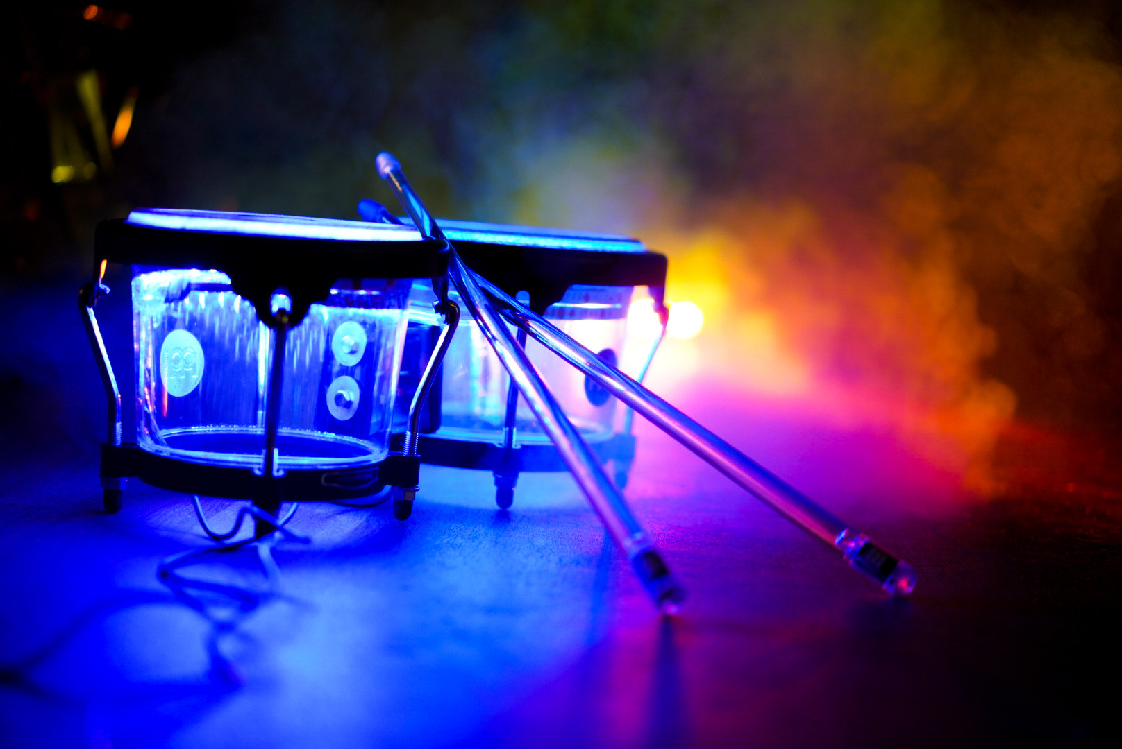 LED Bongo Photo 3 Close up of LED bongos and sticks on a stage at an event