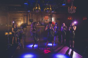 Female musicians and live DJ at corporate party